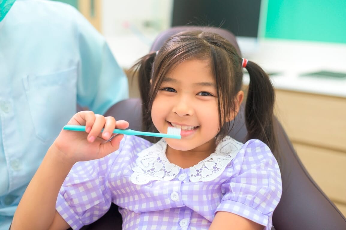 female dentist demonstrating